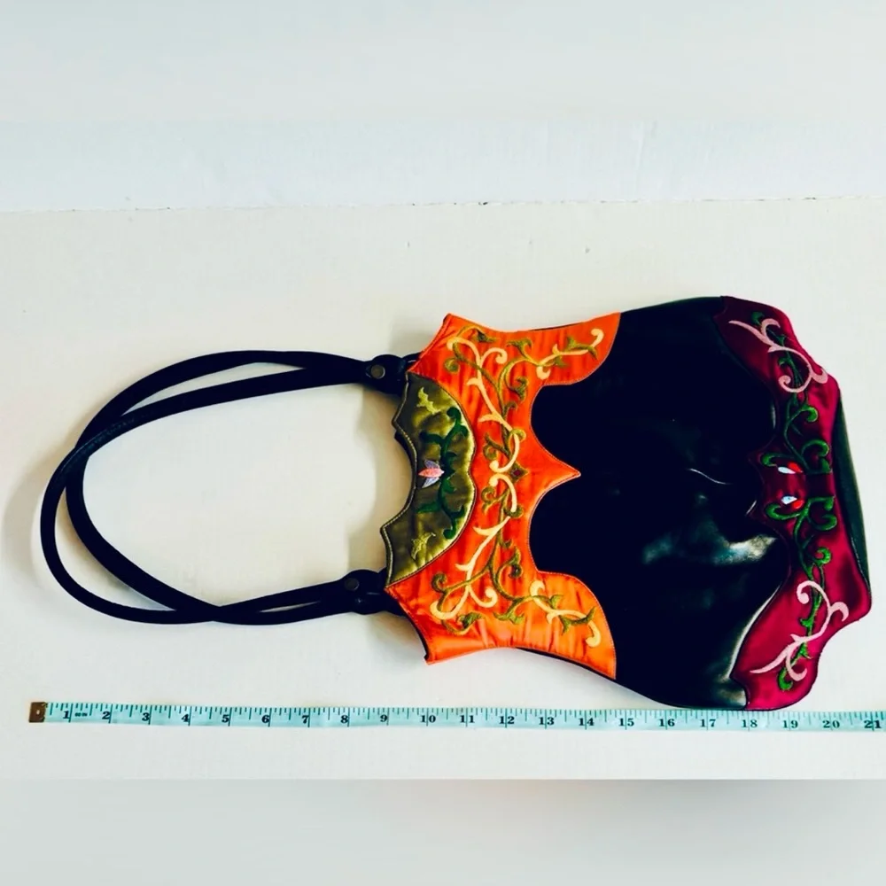 Vtg.Oovoo-Black shiny leather with orange+purple with hand embroidered silk.